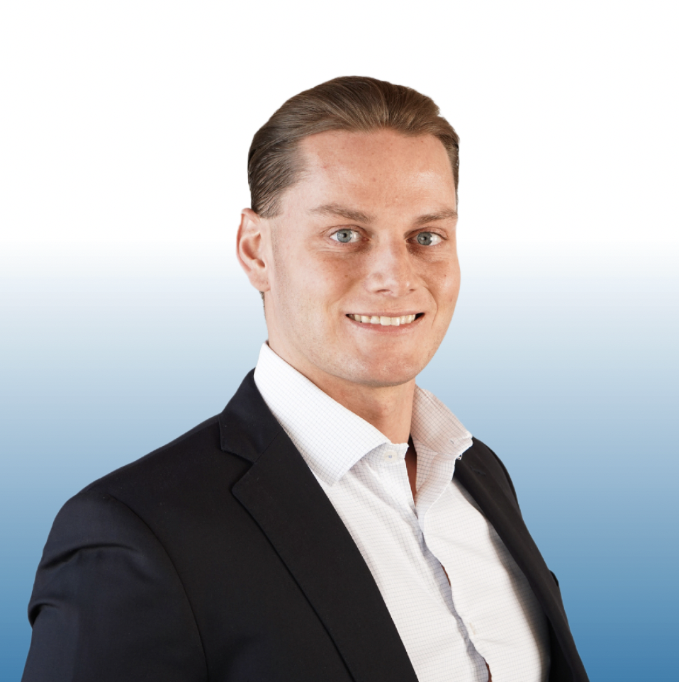 Equity commercial real estate professional in navy blazer and white shirt